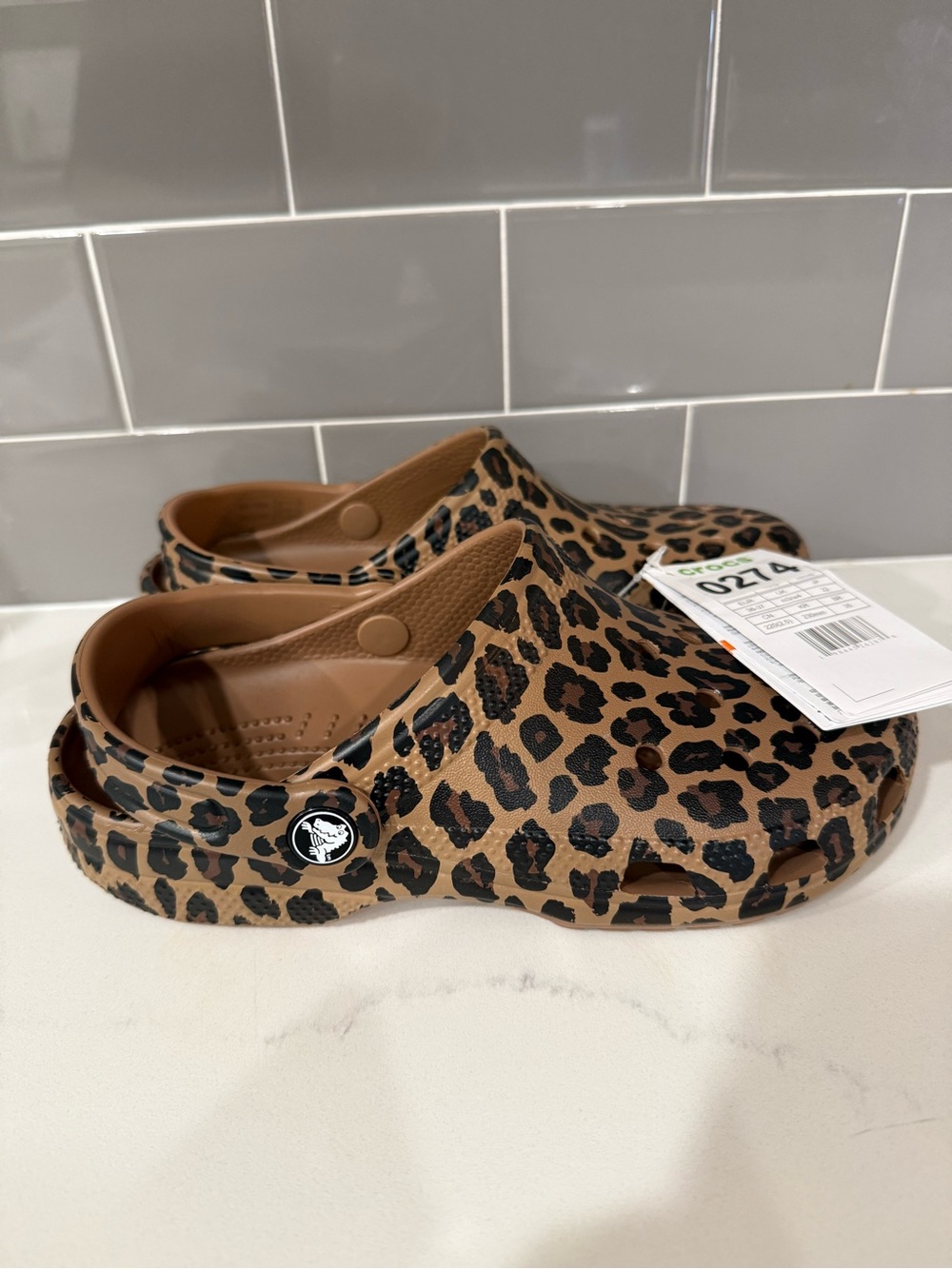 CROCS size 6 Leopard Print Clogs - Tan and Black